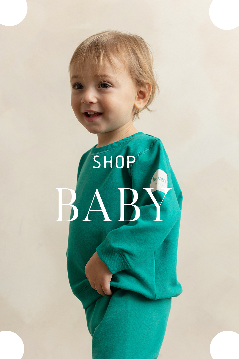 A toddler wearing a one piece light blue sleeveless romper.