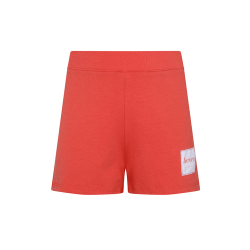 Red shorts with a white patch on a white background
