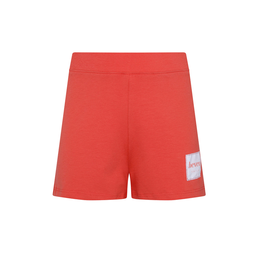 Red shorts with a white patch on a white background