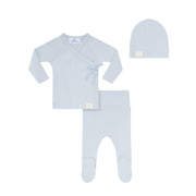 Baby clothing set with long-sleeve shirt, pants, and hat on a white background