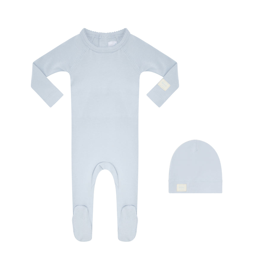 Light blue footie and beanie on a white background.