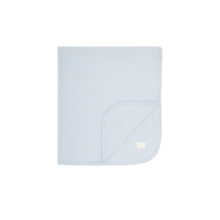 Light blue baby blanket with a small logo on a white background
