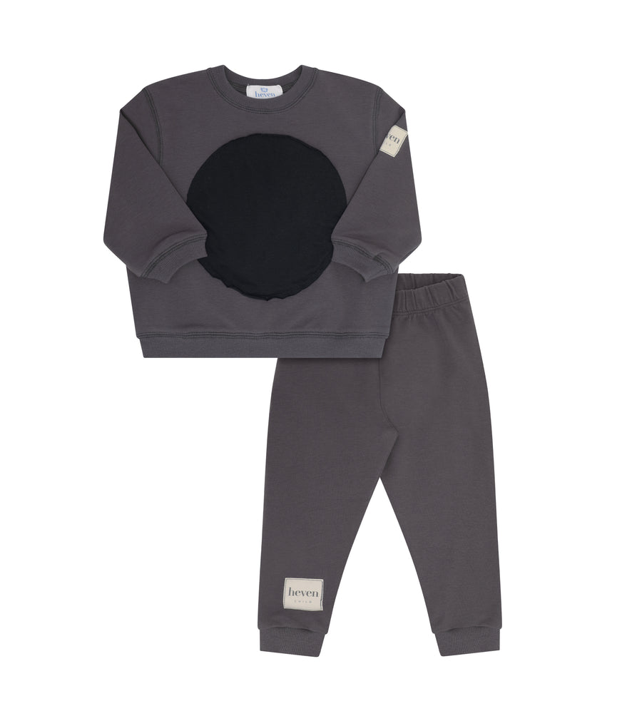 Grey sweatshirt and pants on white background.