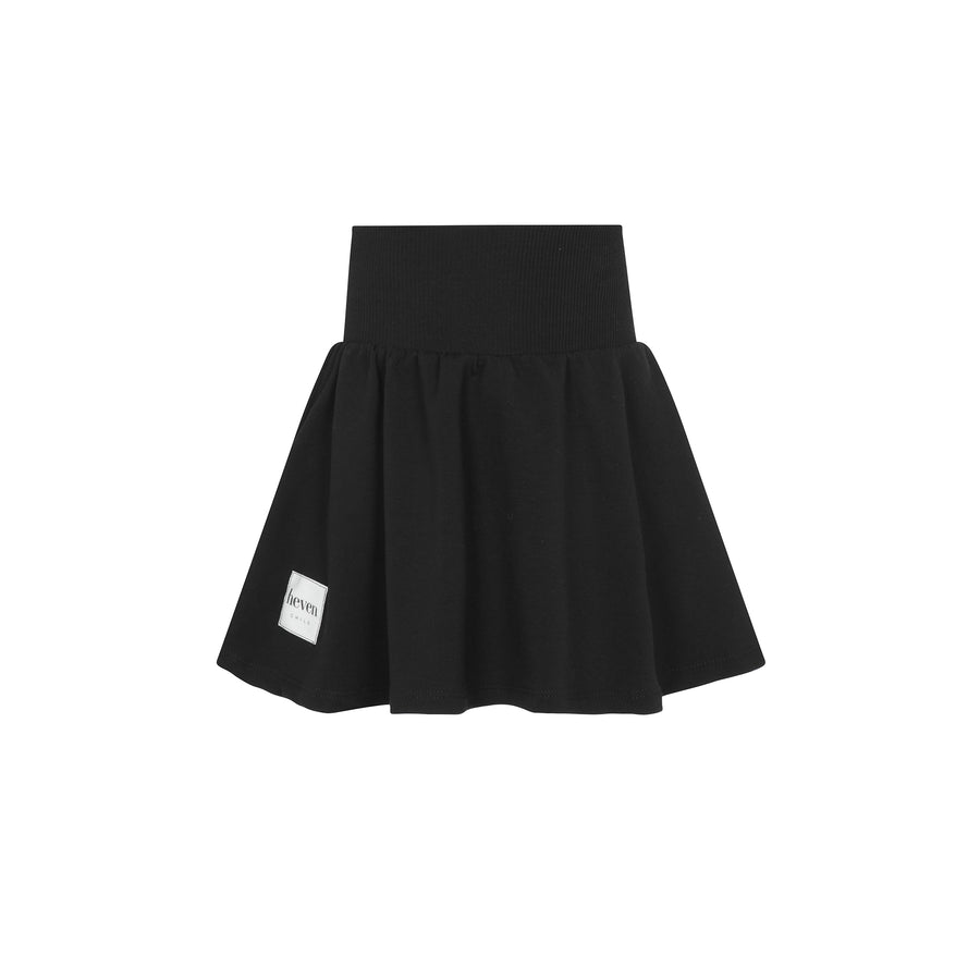 Black high waisted short skirt on a white background.