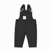 Denim overalls on white background.