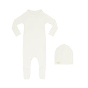 Ivory footsie with matching beanie on a white background.