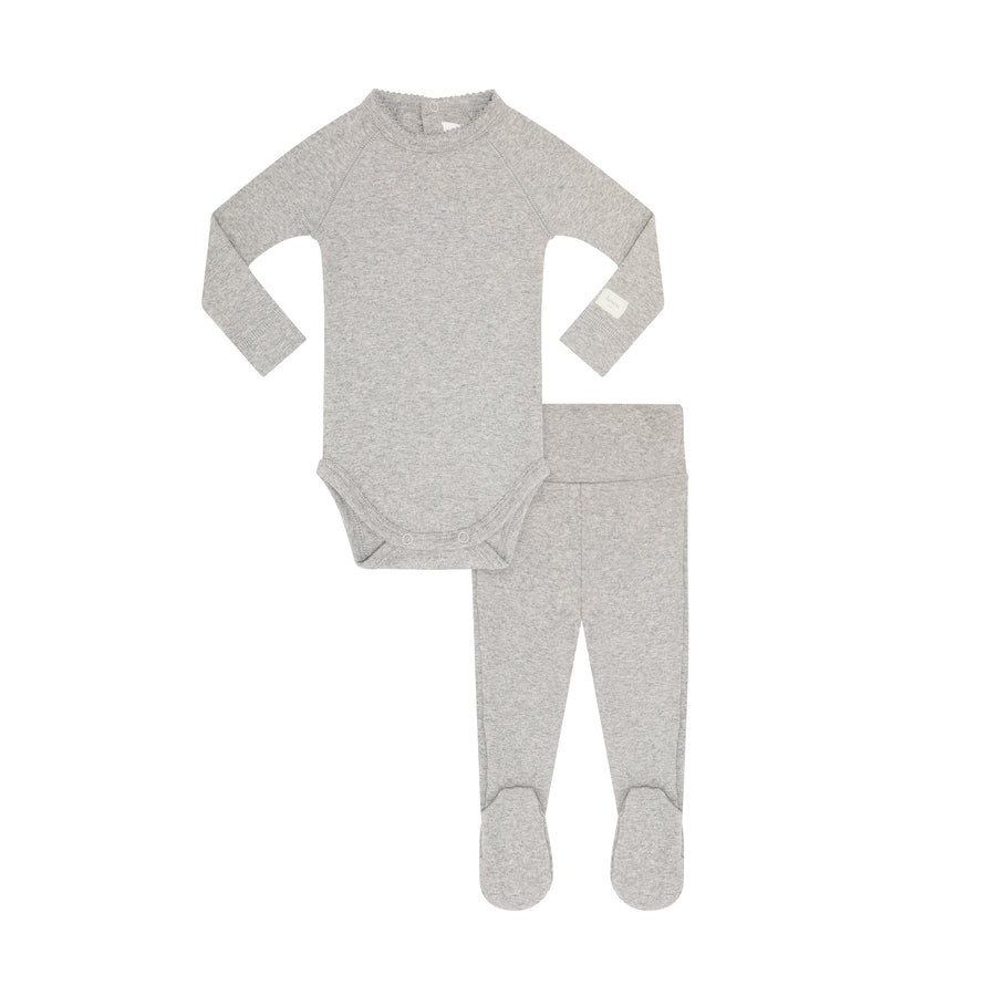A baby two-piece sleepwear set in heather gray, featuring a long-sleeve bodysuit and matching footed leggings, laid flat on a white background.