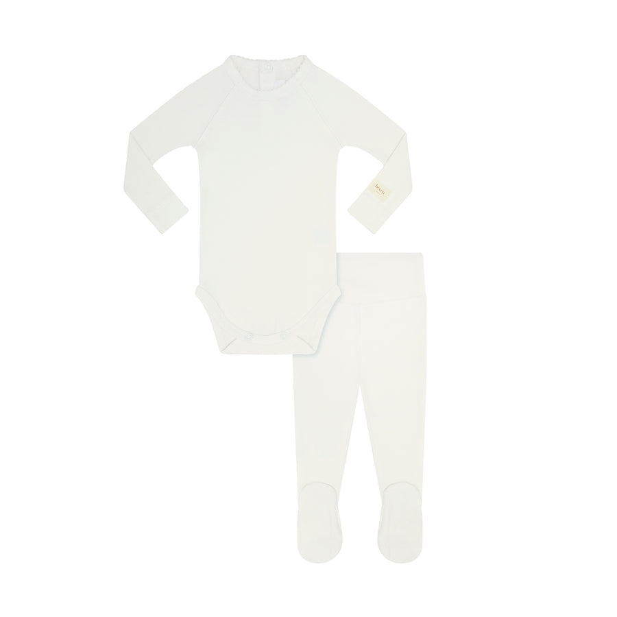 A baby two-piece clothing set consisting of a long-sleeve bodysuit and matching footed leggings, both in solid white, laid flat on a white background.