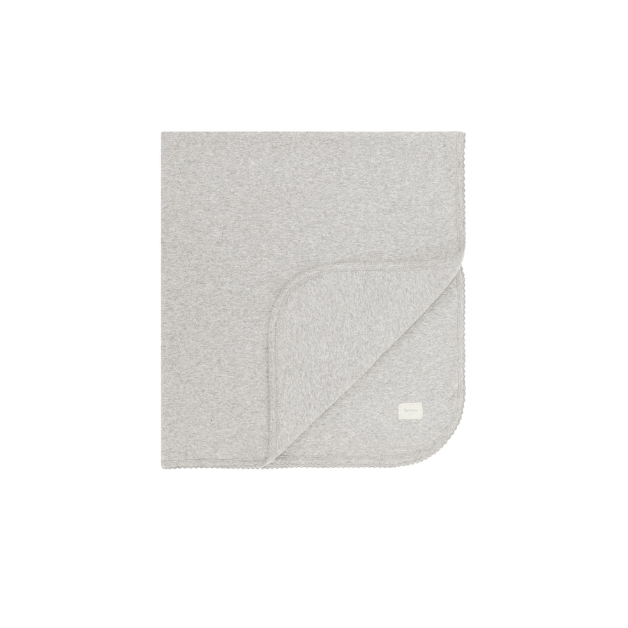 Heather grey folded blanket on a white background.