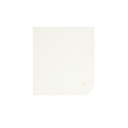 Ivory folded blanket on a white background.