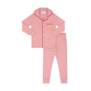 Pink pajama set with red trim on a white background