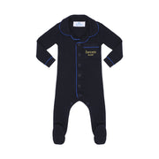 Black baby onesie with blue piping and 'heven sleep' branding on a white background