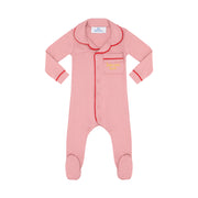 Pink baby onesie with red trim on a white background